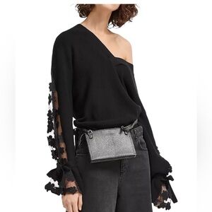 Caballo black V-neck sweater with floral lace sleeves and self-tie ribbon cuffs